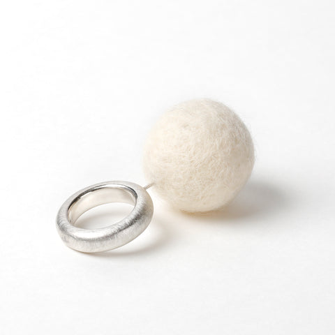 Close-up of beige felt sphere on The Steppe silver ring showing texture and craftsmanship