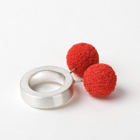 Top view showing dual red sphere design on silver band