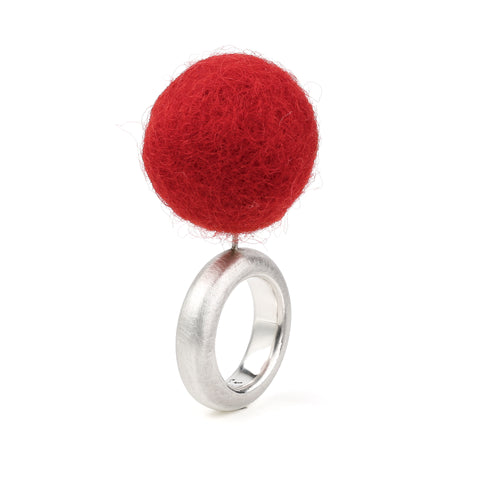 Close-up of red felt sphere on The Steppe silver ring showing texture and craftsmanship